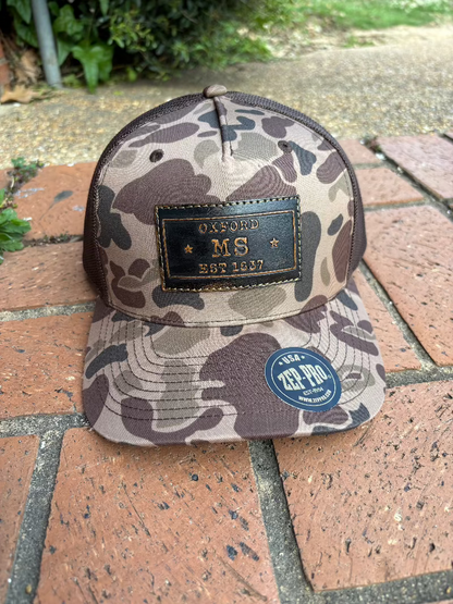 Zep-Pro rectangle leather patch with Oxford, Mississippi Established 1817 on an old school brown camo Richardson 112PFP cap. Cap features a brown mesh back and is adjustable. Front View