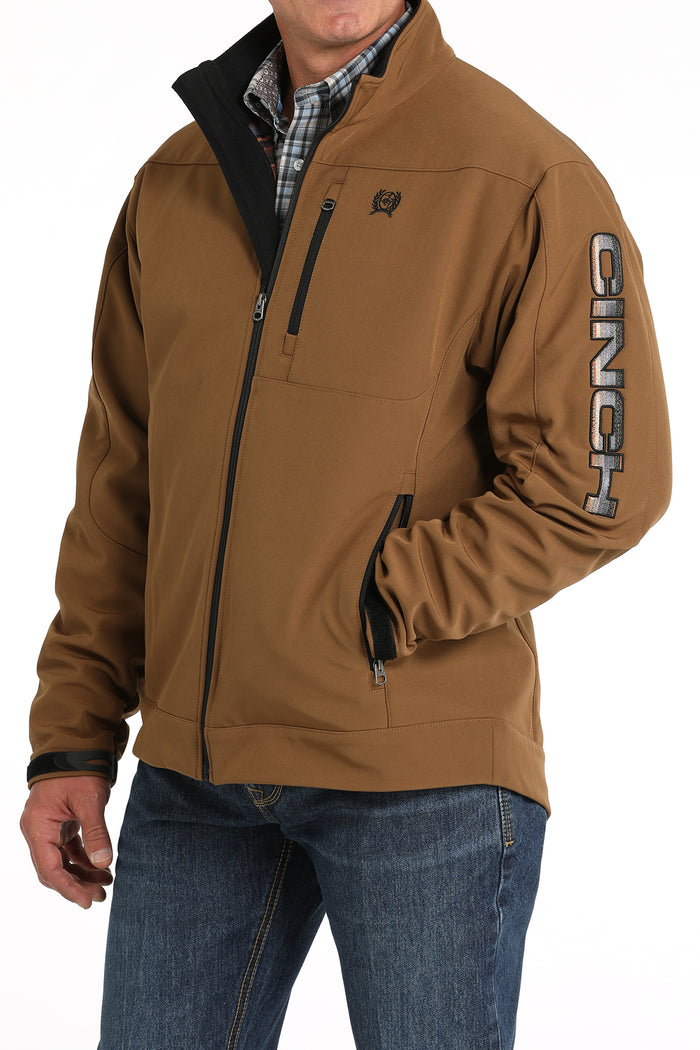 Brown inch bonded jacket with Cinch block-printed on left bicep  of sleeve. Front left view.