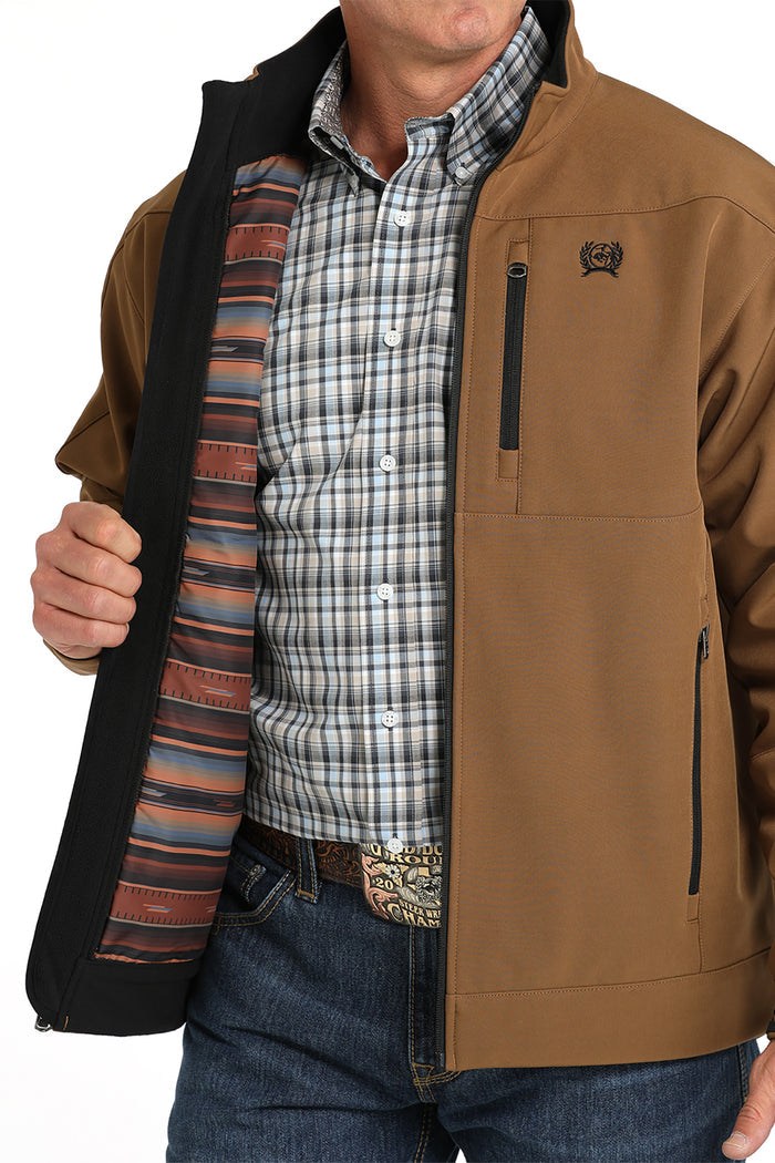 Brown Cinch jacket. View shows inside printed serape lining.